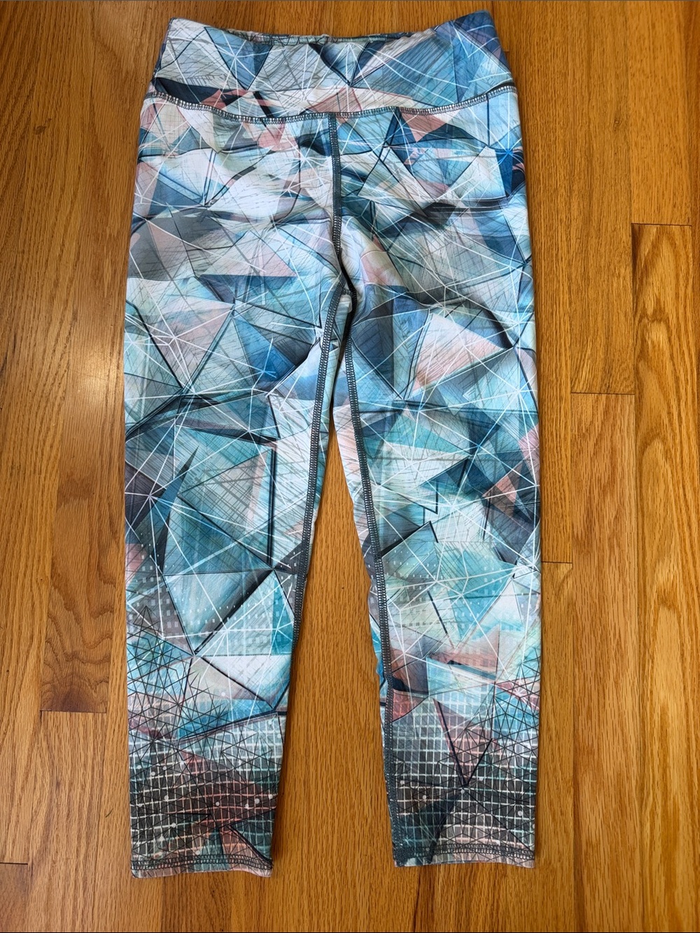 Evolution and Creation Blue & Pink Geometric Print Leggings, 3/4 cropped.